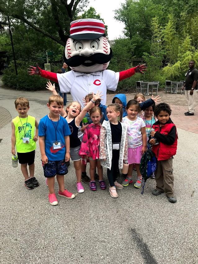 reds baseball mascott with children at the Zoo