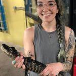 Emily Virgin holding baby alligator
