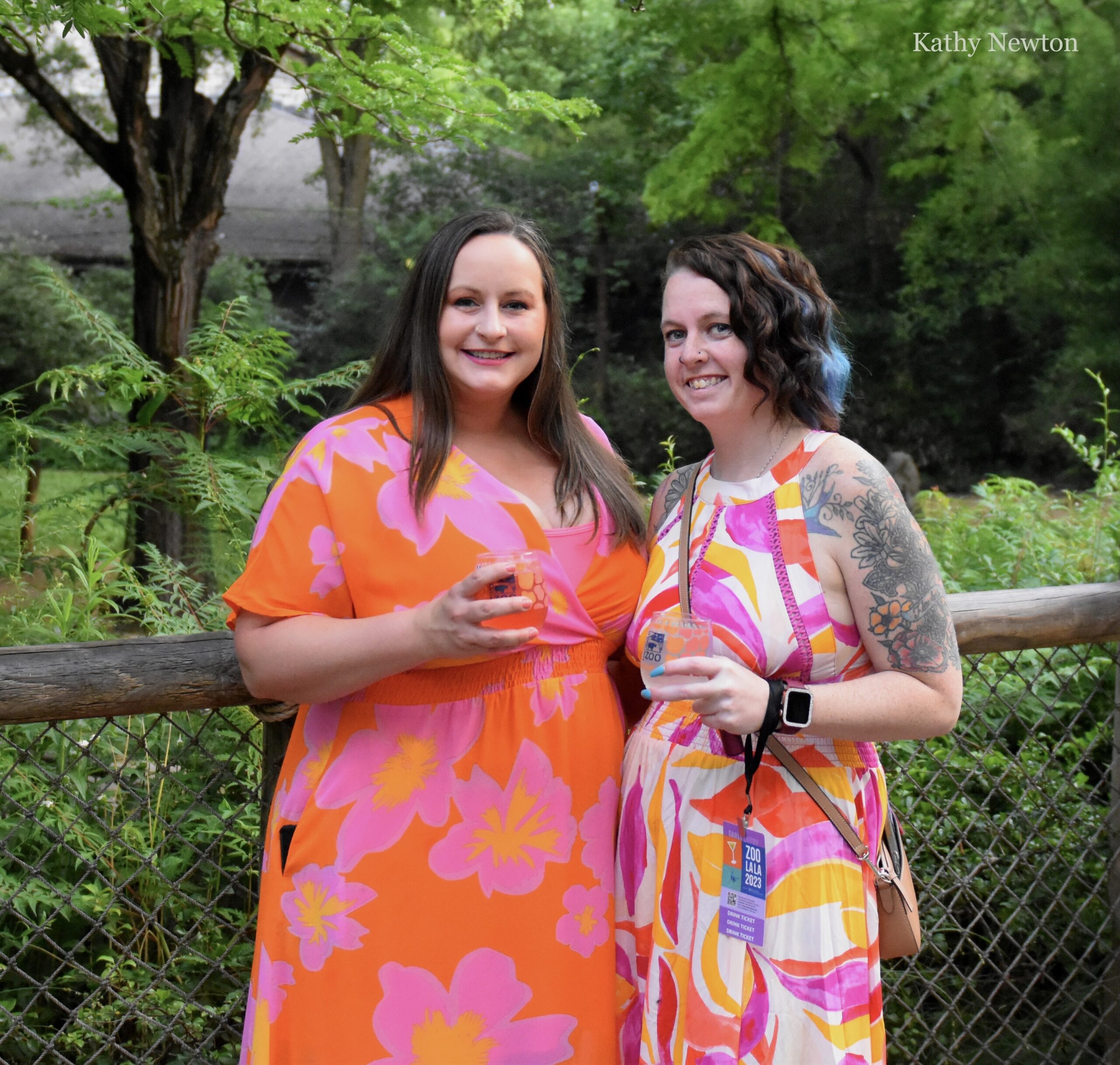 two women in bright dresses at the zoo