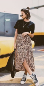 woman wearing black shirt and leopard print skirt