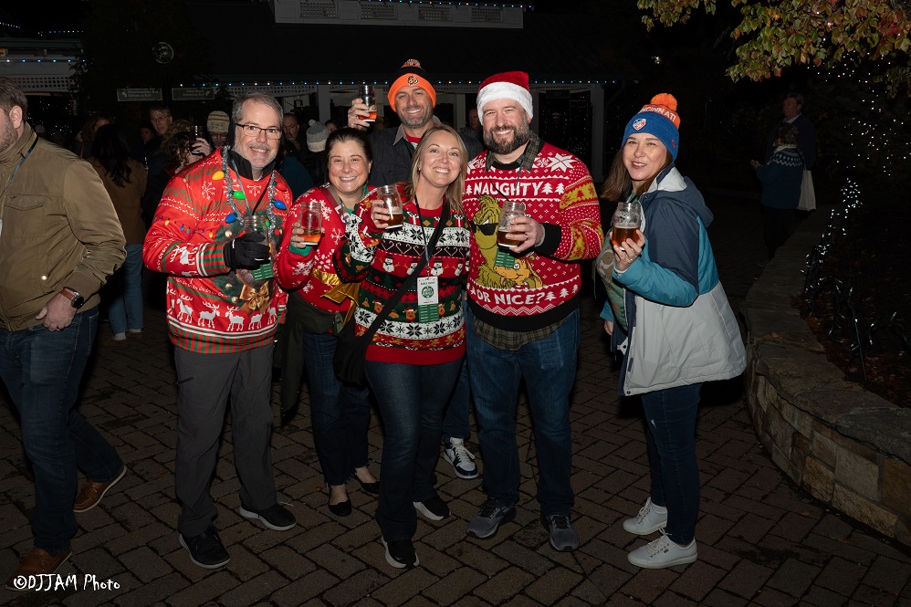 hops & holly guests wearing festive clothes posing for photo