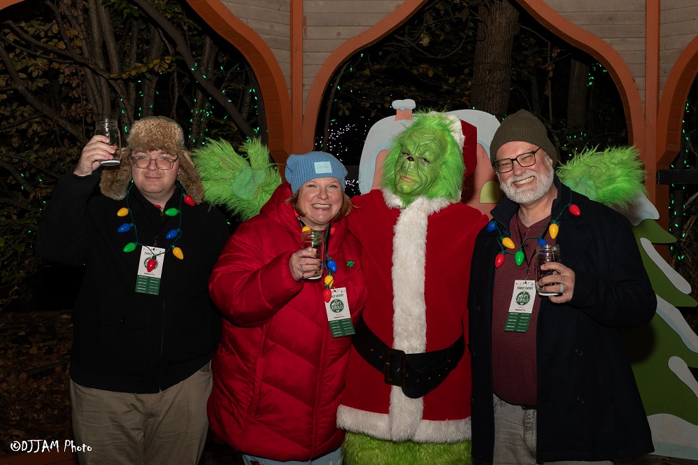 hops & holly guests wearing festive clothes posing for photo
