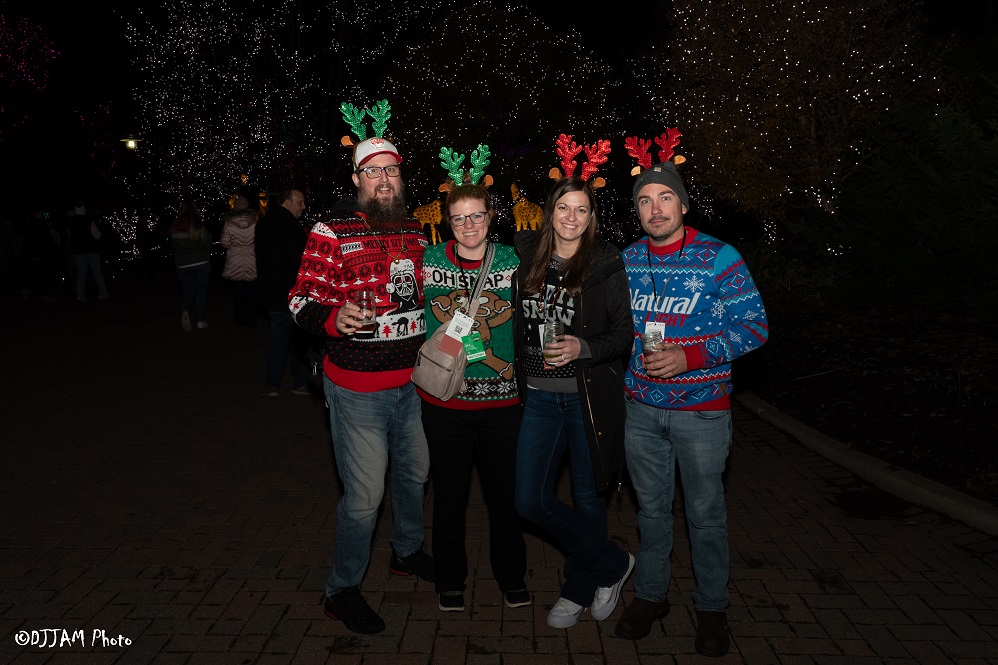 hops & holly guests wearing festive clothes posing for photo