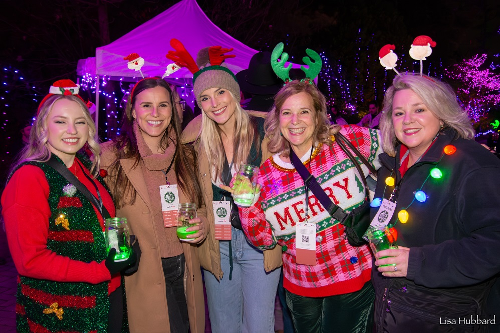 hops & holly guests wearing festive clothes posing for photo