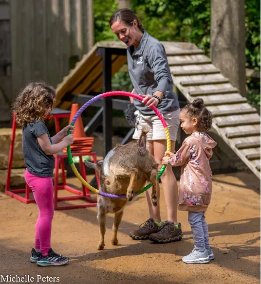 kids helping keeper during barnyard bonanza