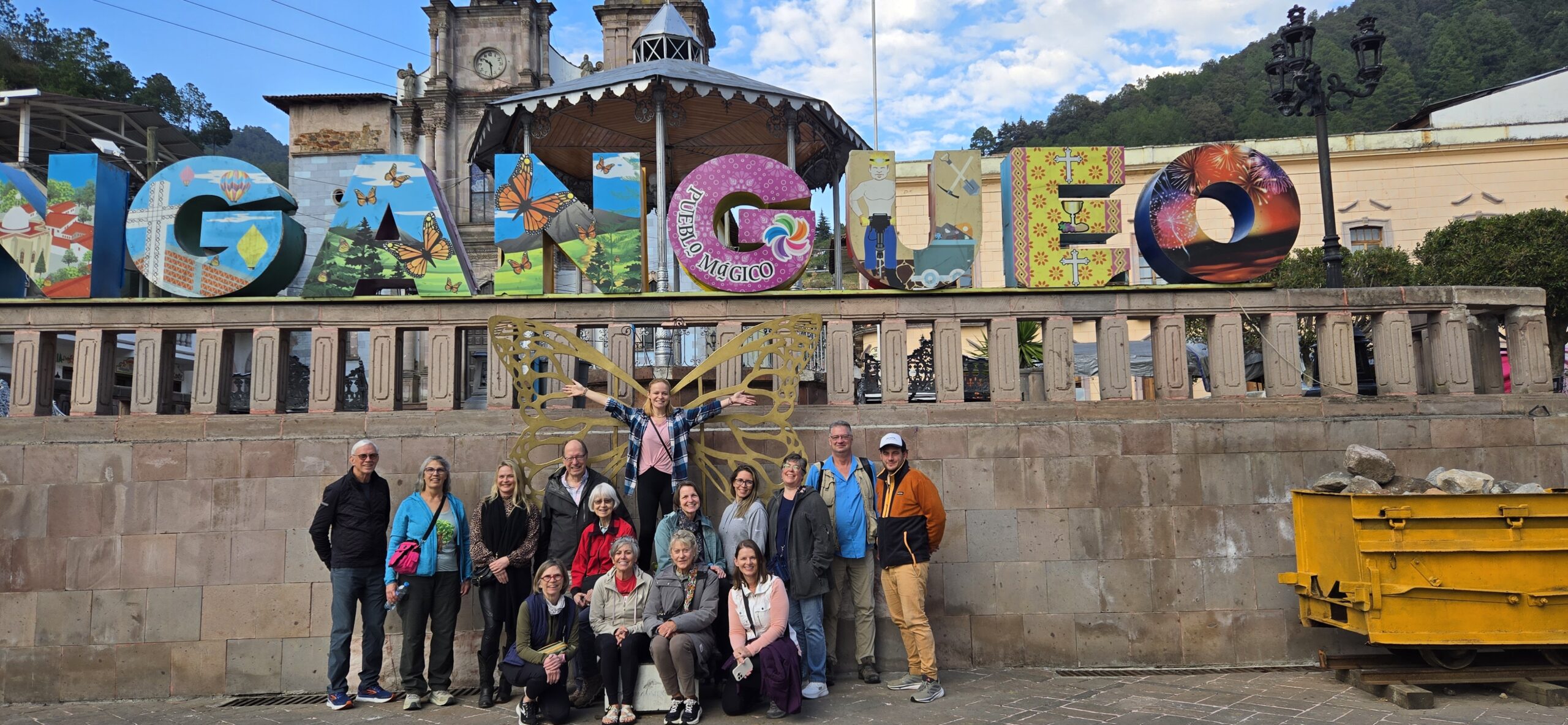 travel with the zoo trip group posing for group photo