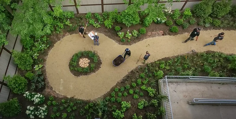 zoo employees working on a garden